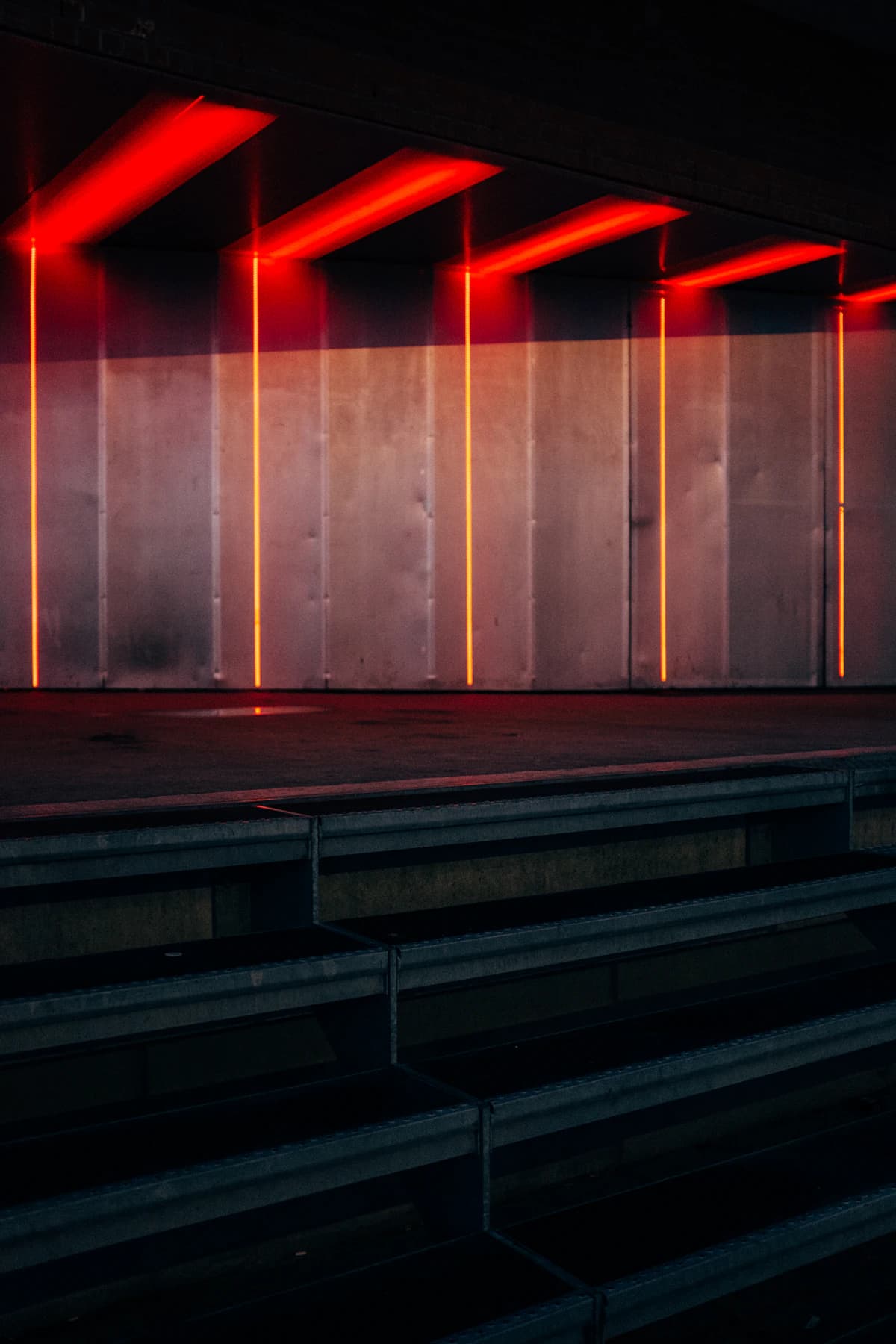 Red neon strips over the steps down to the floor